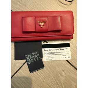 Preloved Prada Saffiano Bow Continental Wallet in Peonia can be woc